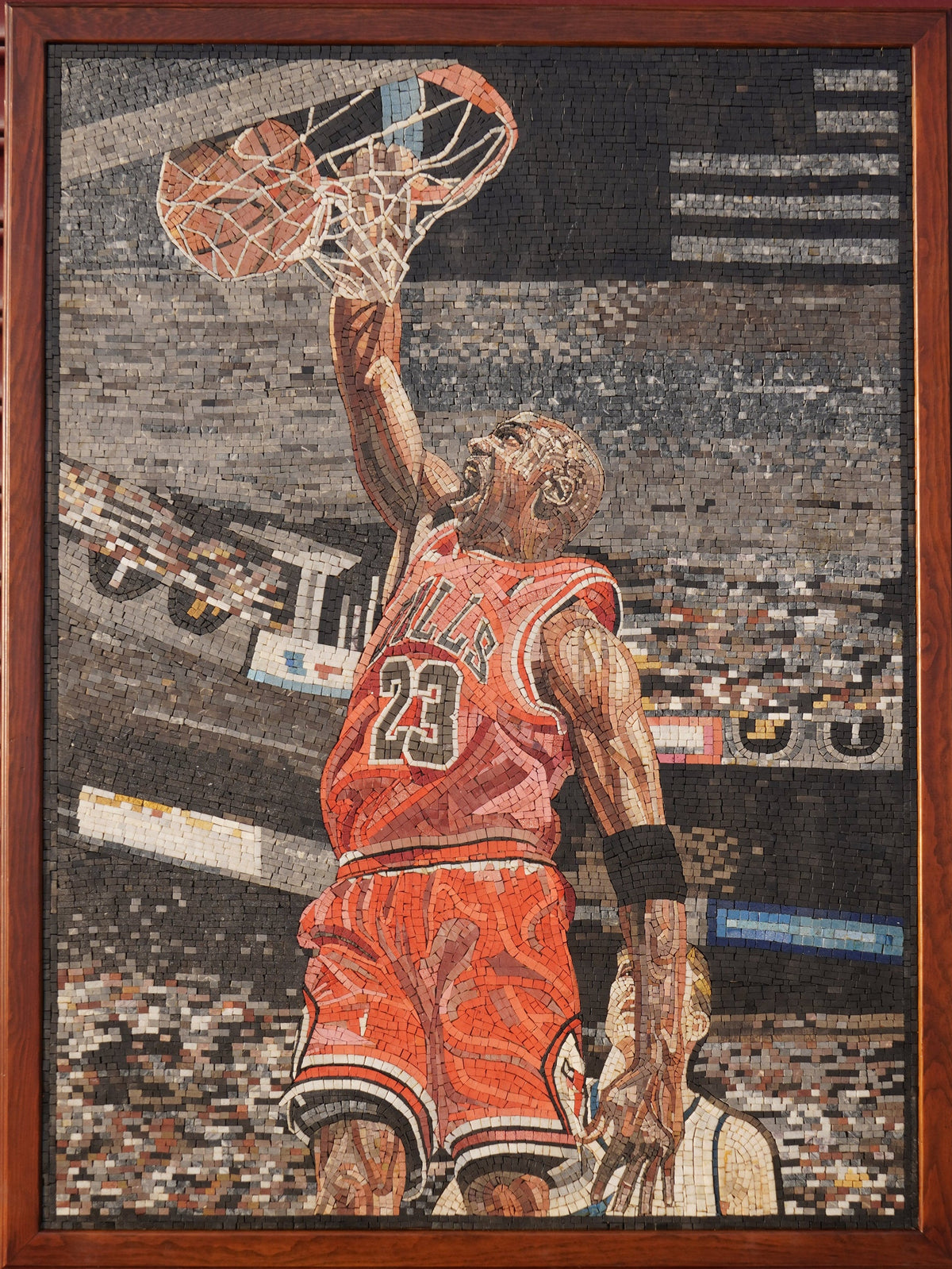 Dynamic mosaic artwork featuring a basketball player in a red jersey soaring for a dunk against a cheering crowd background