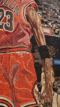 Vibrant mosaic artwork depicting a basketball player in a red jersey with intricate tile details showcasing athletic movement