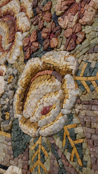 Intricate floral mosaic art piece featuring natural stone in warm hues — a detailed display of craftsmanship and texture