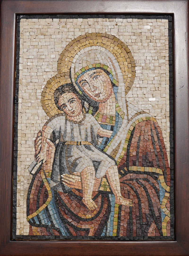 Intricate mosaic art depicting a mother and child in warm earth tones — detailed craftsmanship showcasing textured tiles.