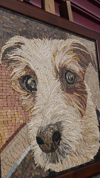 Detailed mosaic artwork depicting a dog's face with intricate textures and warm earthy tones in a wooden frame