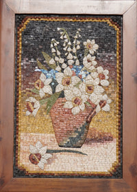 Intricate mosaic artwork depicting a vase of white flowers with earthy tones and detailed textures in a wooden frame