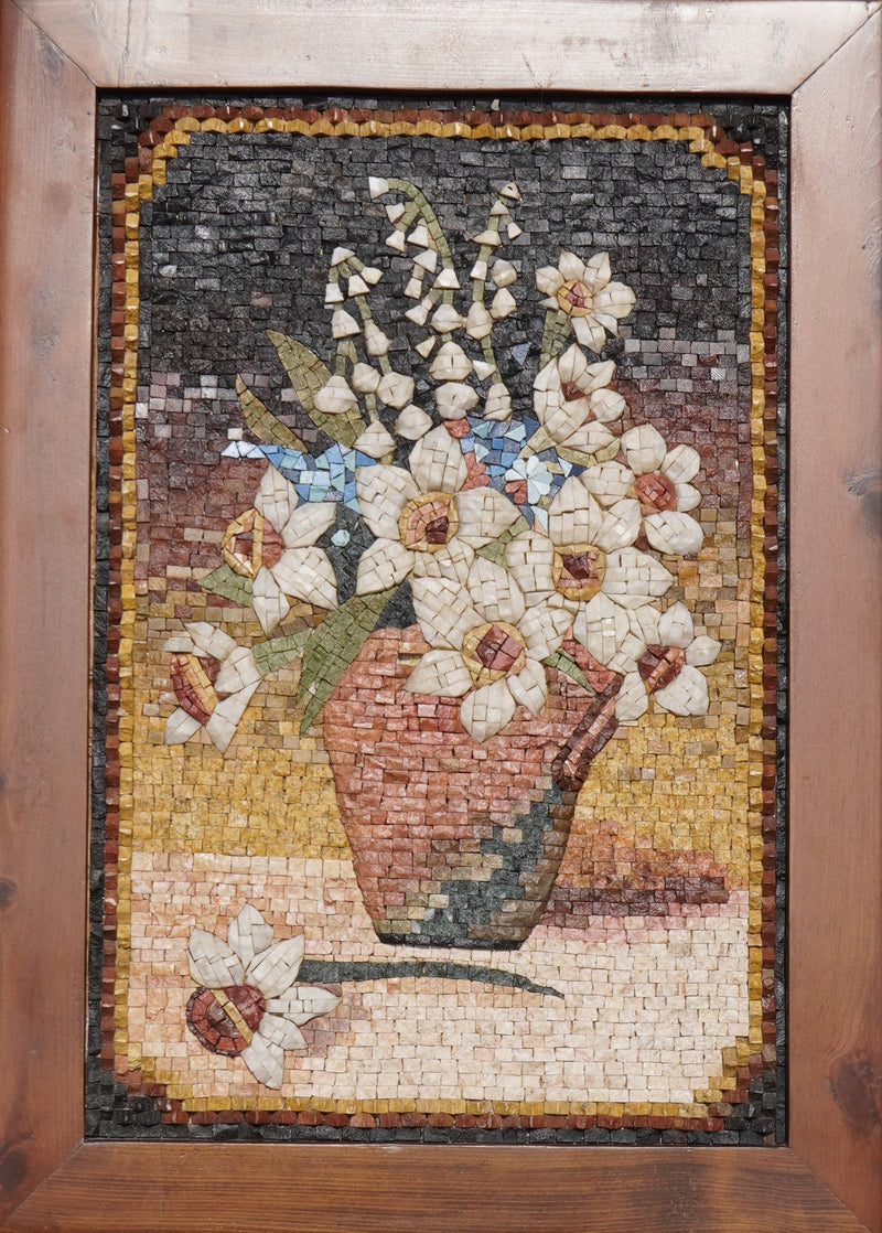 Intricate mosaic artwork depicting a vase of white flowers with earthy tones and detailed textures in a wooden frame