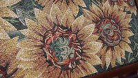 Intricate mosaic art featuring vibrant sunflowers in earthy tones — a detailed display of craftsmanship and texture.
