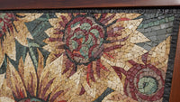 Intricate mosaic wall art featuring sunflowers in earthy tones—crafted from natural stone with a textured finish