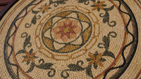 Intricate mosaic design featuring floral patterns in earthy tones — handcrafted tiles with a rich textured finish