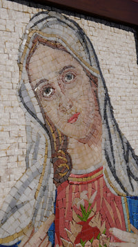 Intricate mosaic artwork depicting a serene figure with flowing hair and detailed facial features — vibrant colors and texture create depth.