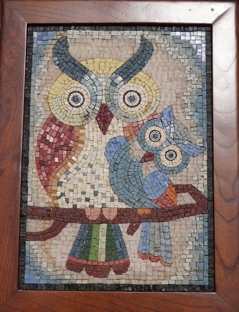 Colorful mosaic artwork featuring an owl and its chick perched on a branch — intricate tile design with vibrant hues