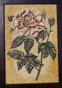 Decorative wall art with a floral design on a wooden easel.